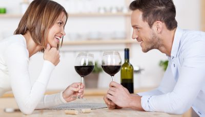 A couple sharing a bottle of wine